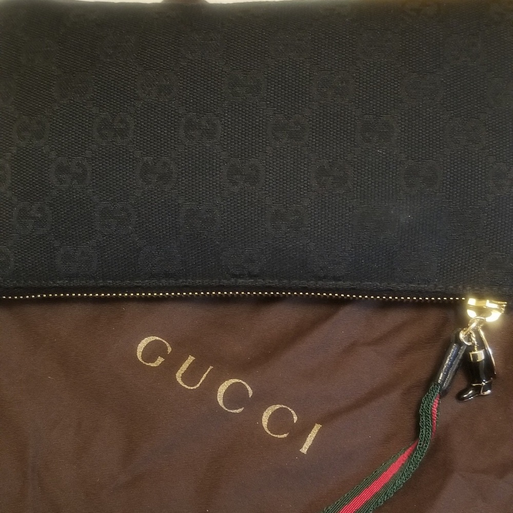 black gg canvas wristlet